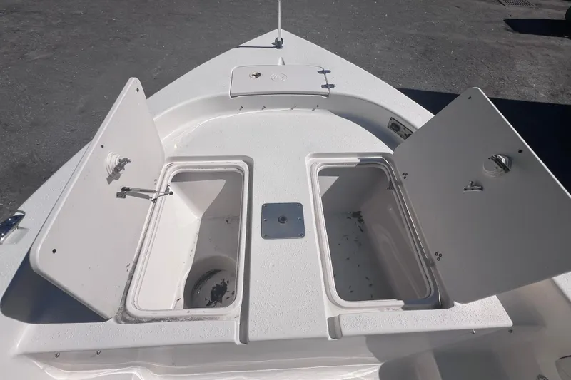 Slide: The Image of 2020 Sea Chaser 21 Sea Skiff boat deck with open storage compartments. - 31