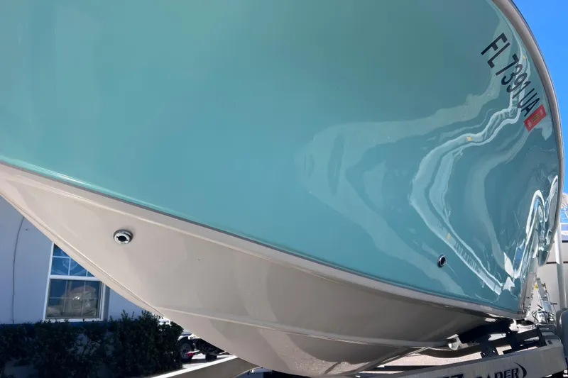 Slide: The Image of 2020 Sea Chaser 21 Sea Skiff boat on trailer, close-up view of hull. - 5