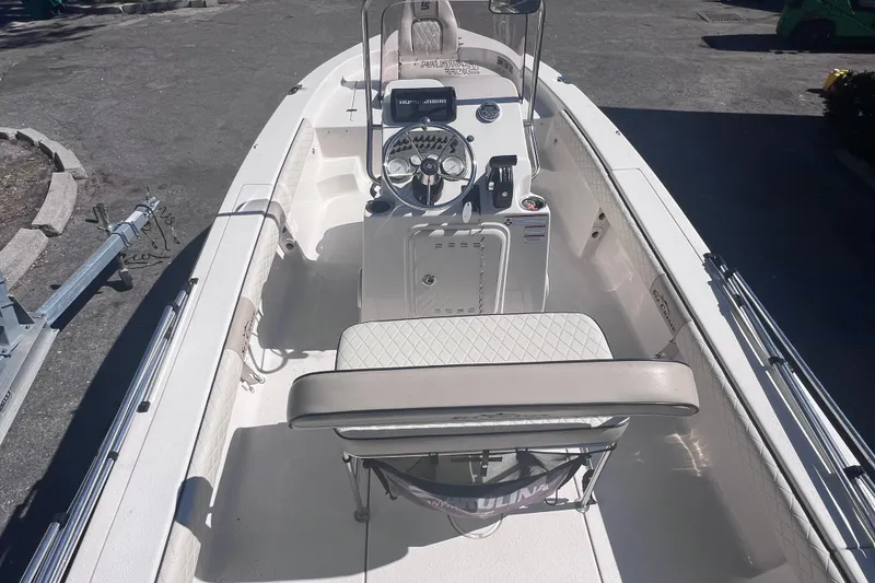 Slide: The Image of 2020 Sea Chaser 21 Sea Skiff boat interior with steering console and seating. - 7