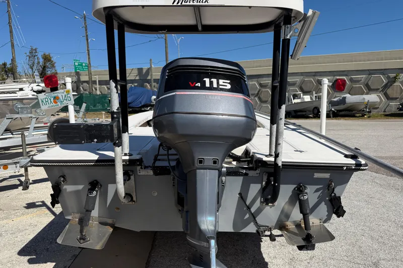 Slide: The Image of 2000 Maverick 18 Master Angler boat with Yamaha V4 115 outboard motor, parked on a trailer. - 10