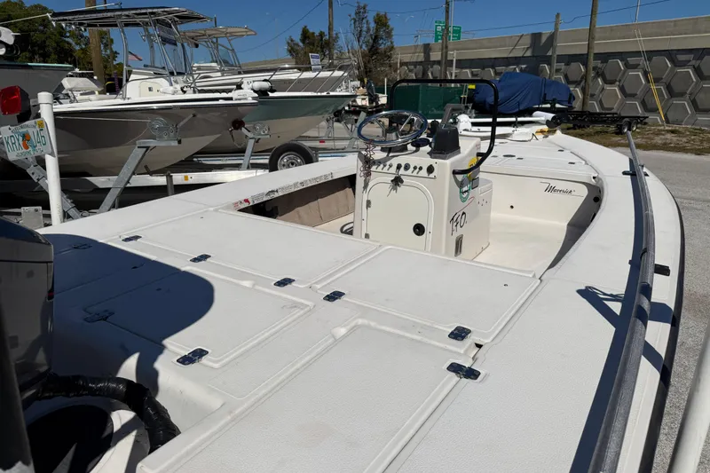 Slide: The Image of 2000 Maverick 18 Master Angler boat in a marina, showcasing deck and console. - 11