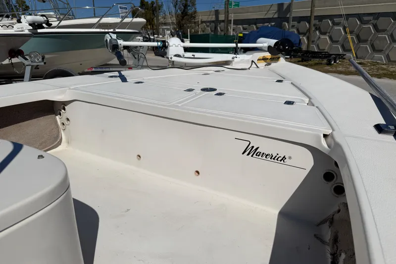 Slide: The Image of 2000 Maverick 18 Master Angler boat interior with storage compartments and logo. - 13