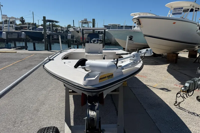 Slide: The Image of 2000 Maverick 18 Master Angler boat on trailer at marina, surrounded by other boats. - 3