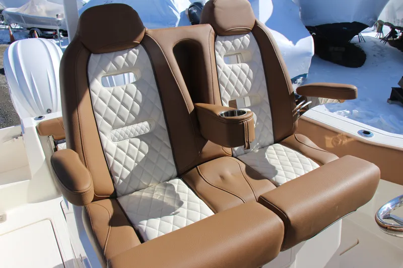 Slide: The Image of Luxurious seating on 2026 Pioneer 270 Pelagic boat with brown and white quilted upholstery. - 10
