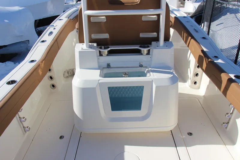Slide: The Image of 2026 Pioneer 270 Pelagic boat interior with seating and storage features. - 13