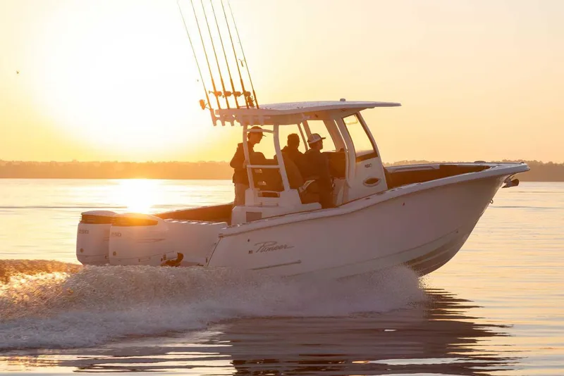Slide: The Image of Manufacturer Provided Image: 2025 Pioneer 270 Pelagic boat cruising at sunset on calm waters. - 17