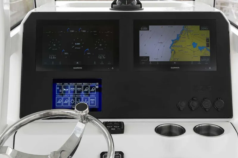 Slide: The Image of Manufacturer Provided Image: Dashboard of 2025 Pioneer 270 Pelagic boat with Garmin navigation displays. - 21