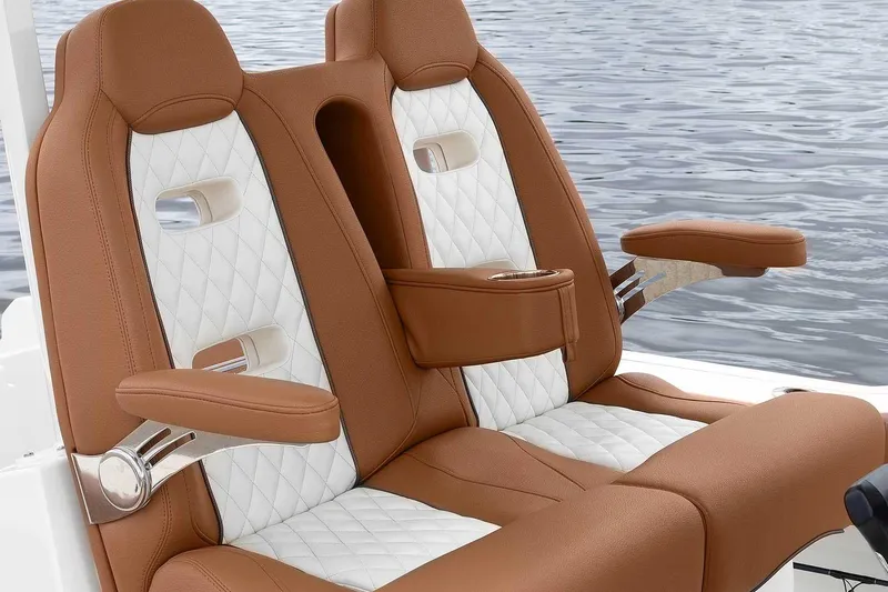 Slide: The Image of Manufacturer Provided Image: Luxury seating on 2025 Pioneer 270 Pelagic boat, featuring brown and white upholstery. - 22