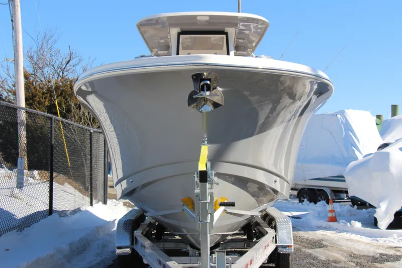 Slide: The Image of 2026 Pioneer 270 Pelagic boat on trailer in snowy outdoor setting. - 6