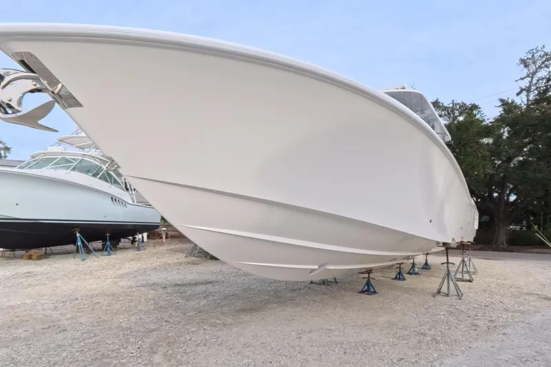 Slide: The Image of 2025 Invincible 39 Open Fisherman boat on stands, side view. - 11