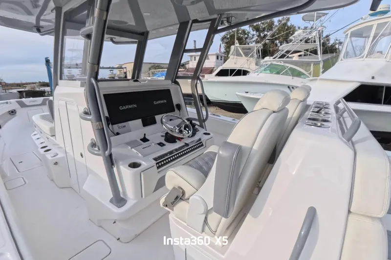 Slide: The Image of 2025 Invincible 39 Open Fisherman boat interior with Garmin navigation system. - 4
