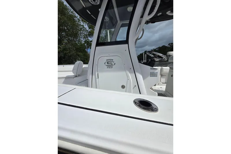 Slide: The Image of 2022 Sportsman Open 262 Center Console boat, sleek design, white exterior, modern features. - 4