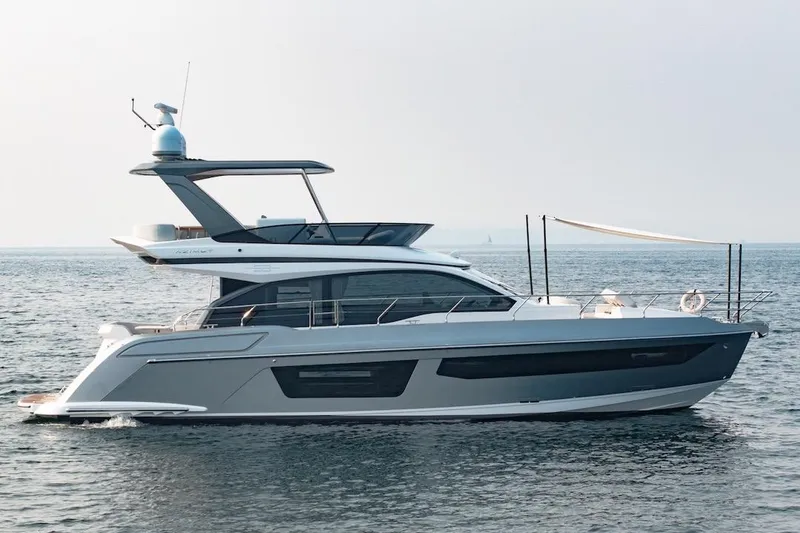 Slide: The Image of 2023 Azimut Fly 53 yacht cruising on open water. - 13