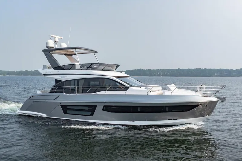 Slide: The Image of 2023 Azimut Fly 53 yacht cruising on open water, side view. - 15