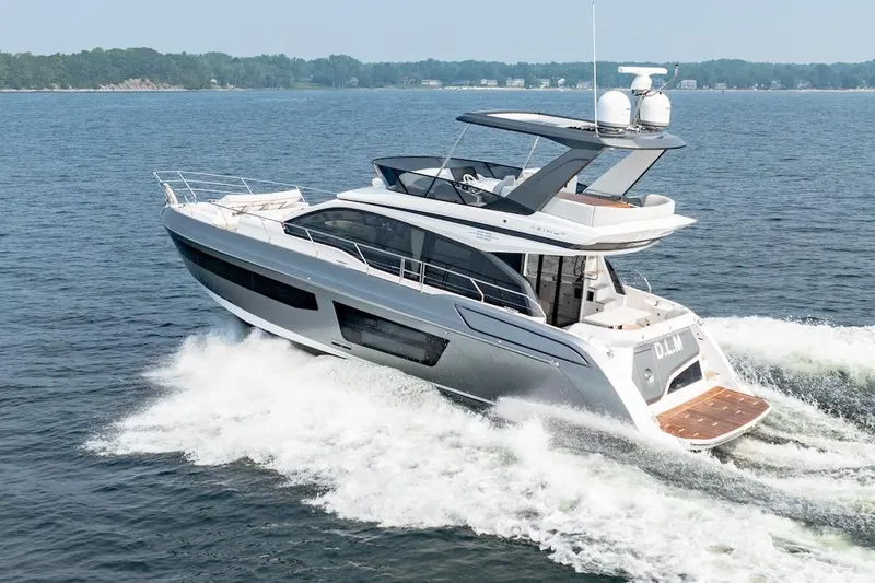 Slide: The Image of 2023 Azimut Fly 53 yacht cruising on open water, showcasing sleek design and luxury features. - 19