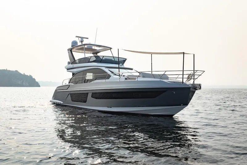 Slide: The Image of 2023 Azimut Fly 53 yacht on calm water, showcasing sleek design and luxury features. - 2