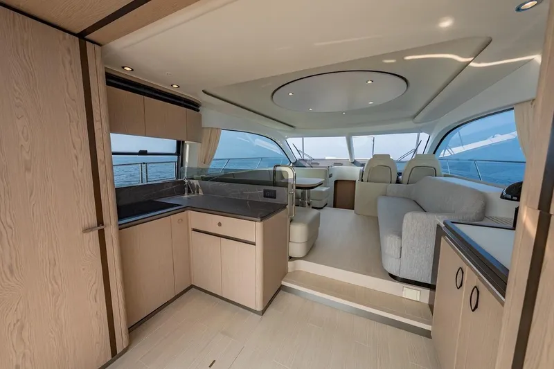 Slide: The Image of Luxurious interior of 2023 Azimut Fly 53 yacht with modern kitchen and seating area. - 23