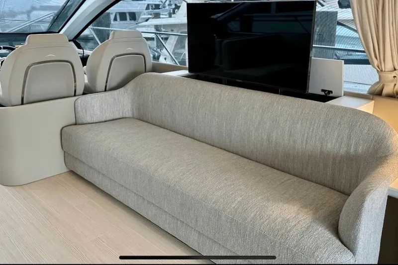 Slide: The Image of Luxurious interior of 2023 Azimut Fly 53 yacht with modern sofa and helm seats. - 29