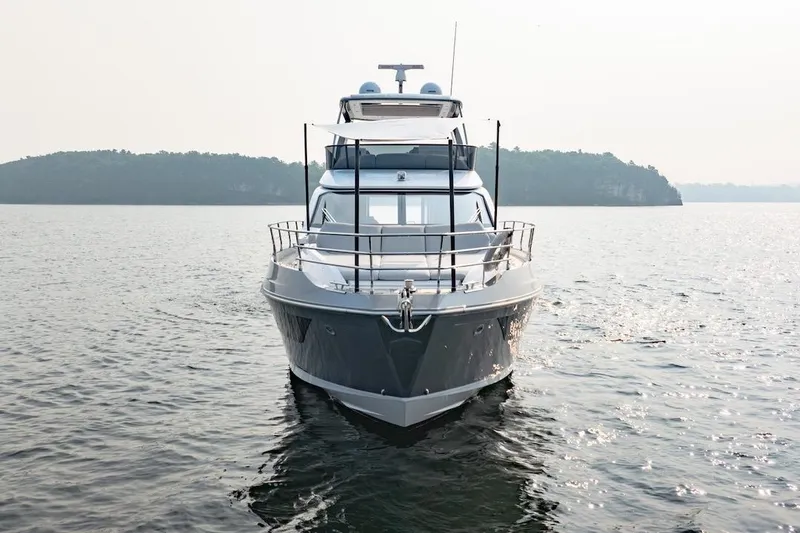 Slide: The Image of 2023 Azimut Fly 53 yacht on calm water with scenic island backdrop. - 3