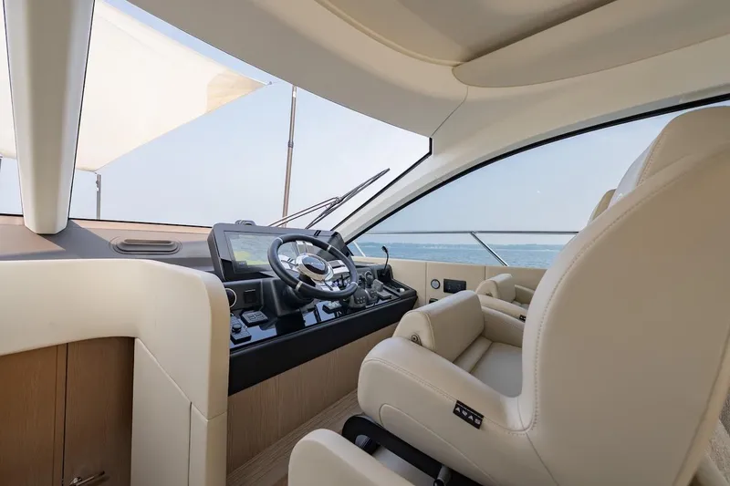 Slide: The Image of Luxurious interior of 2023 Azimut Fly 53 yacht with modern steering and plush seating. - 32