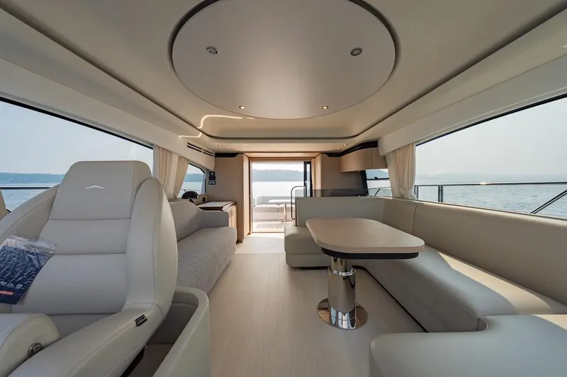 Slide: The Image of Luxurious interior of 2023 Azimut Fly 53 yacht with elegant seating and panoramic windows. - 35