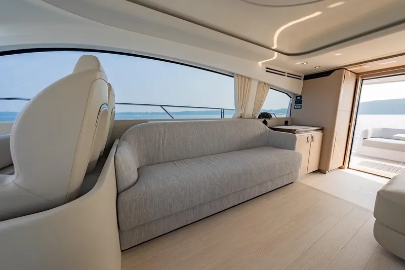 Slide: The Image of Luxurious interior of 2023 Azimut Fly 53 yacht with elegant seating and panoramic windows. - 37