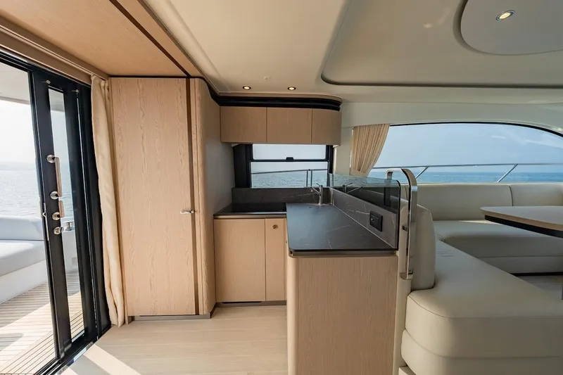 Slide: The Image of Luxurious interior of 2023 Azimut Fly 53 yacht with modern kitchen and seating area. - 38