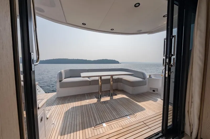 Slide: The Image of Luxurious 2023 Azimut Fly 53 yacht deck with seating, overlooking serene ocean view. - 41