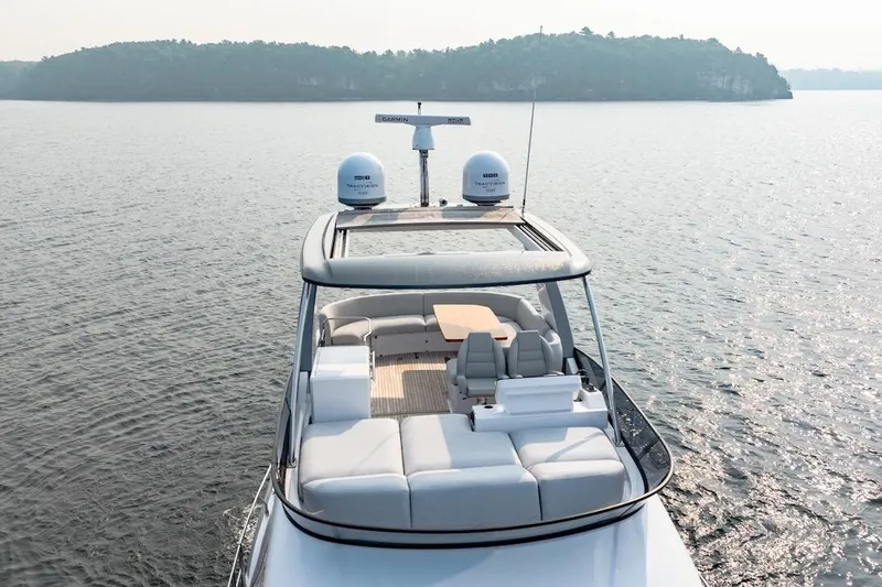 Slide: The Image of 2023 Azimut Fly 53 yacht cruising on serene waters, showcasing luxurious deck seating. - 5