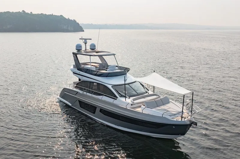 Slide: The Image of 2023 Azimut Fly 53 yacht cruising on calm waters. - 7