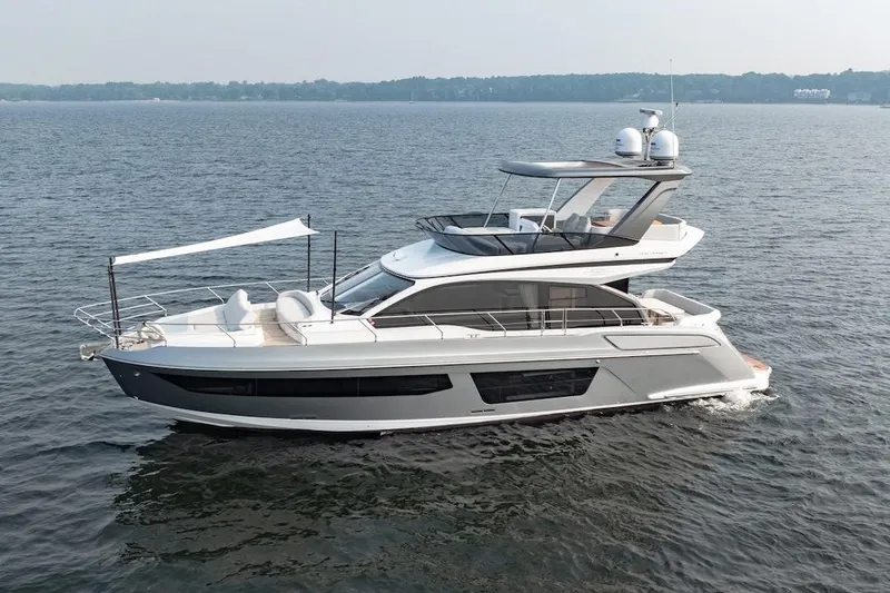 Slide: The Image of 2023 Azimut Fly 53 yacht cruising on open water, showcasing sleek design and luxury features. - 9