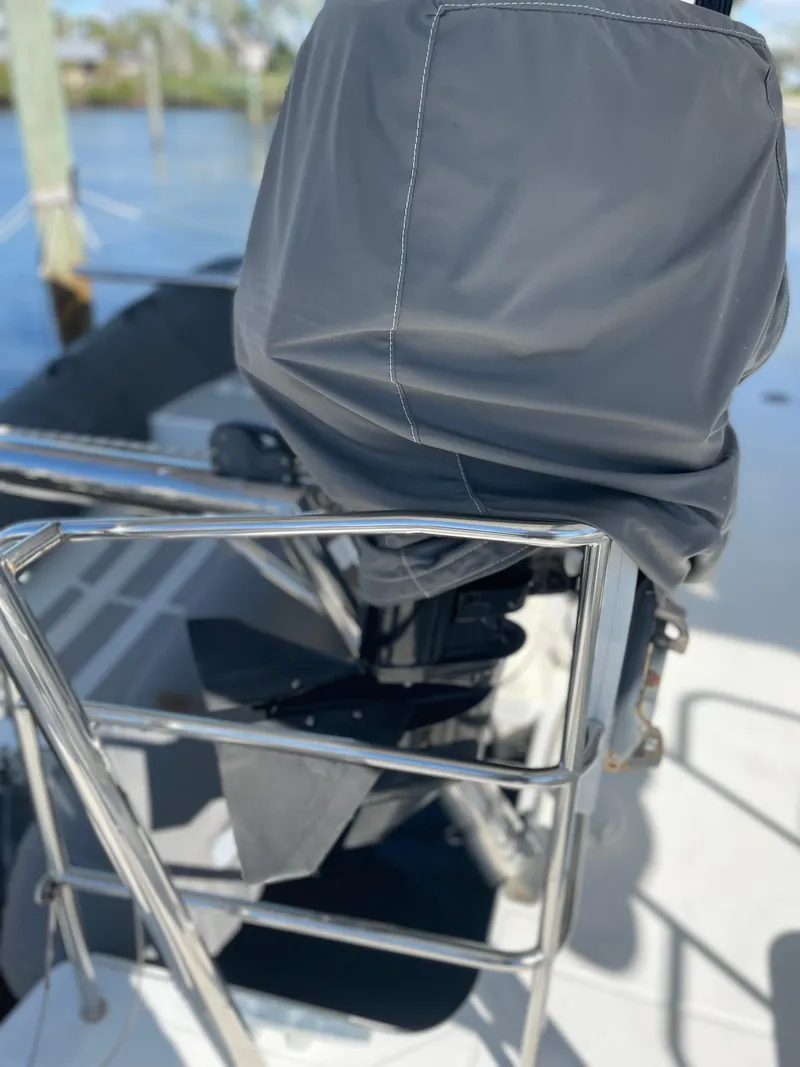Slide: The Image of Covered outboard motor on 2017 Lagoon 39 catamaran, docked by the water. - 18