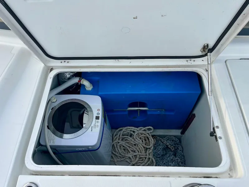 Slide: The Image of Storage compartment on a 2017 Lagoon 39 boat with washing machine and ropes. - 21