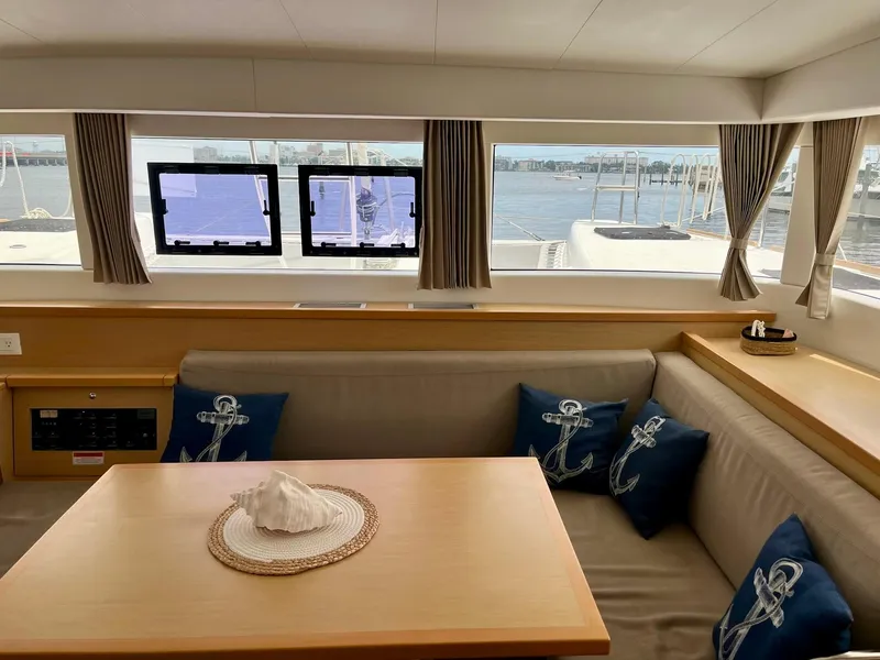 Slide: The Image of Interior of 2017 Lagoon 39 catamaran with cozy seating and nautical-themed decor. - 29