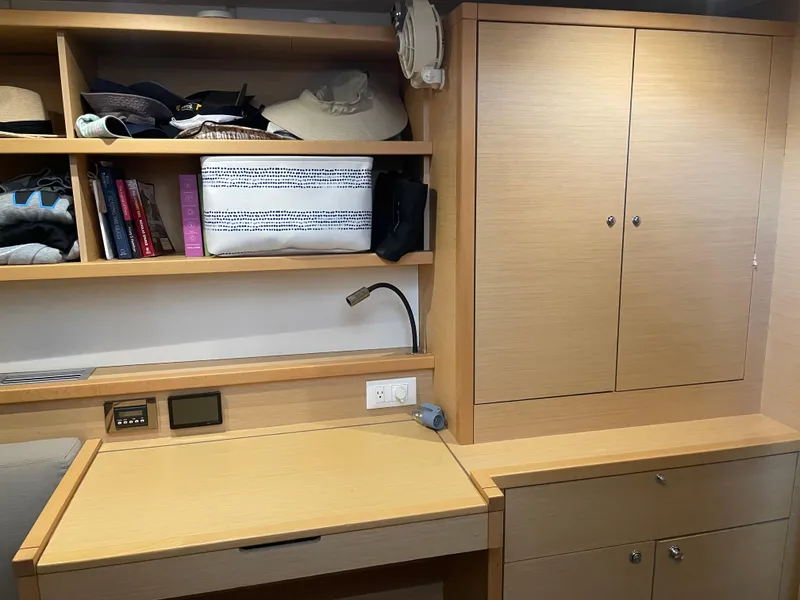 Slide: The Image of Interior of 2017 Lagoon 39 yacht with wooden shelves and desk. - 38
