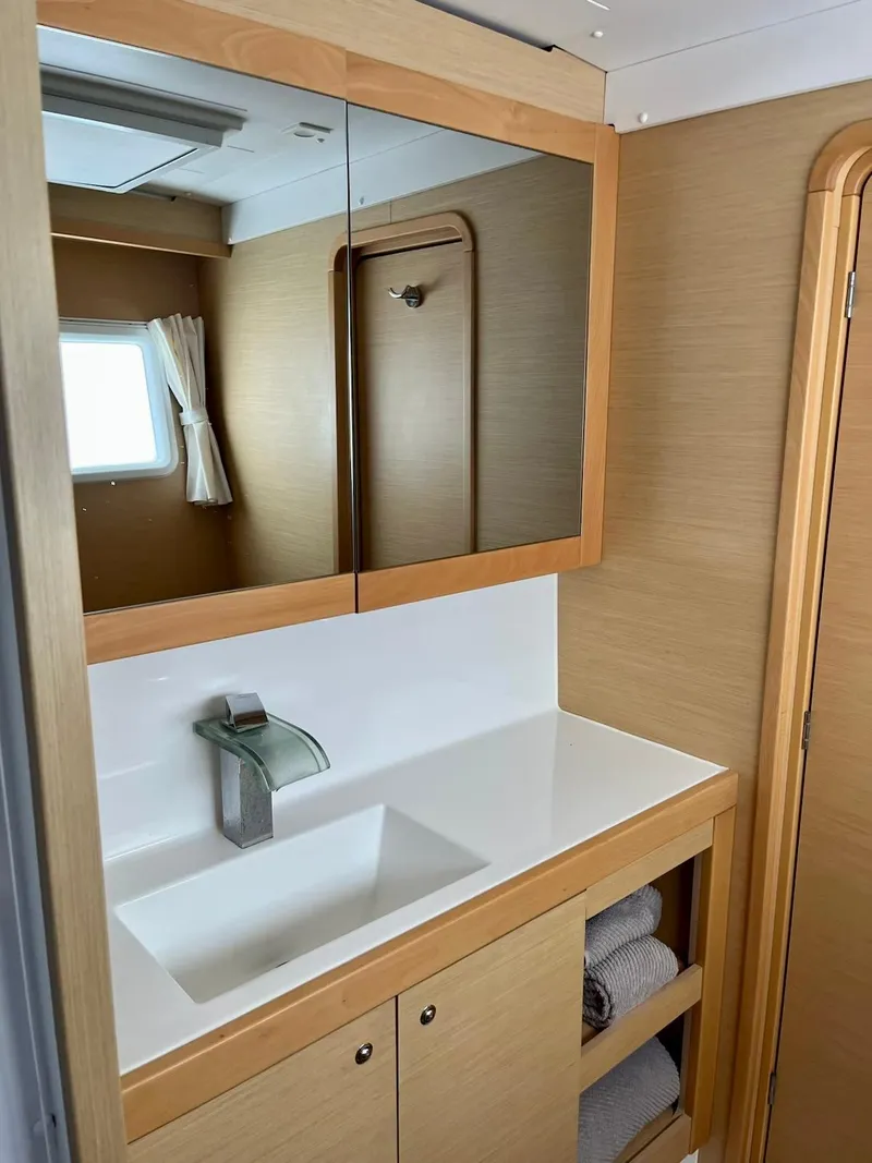 Slide: The Image of Modern bathroom interior in a 2017 Lagoon 39 yacht with mirror and sink. - 40