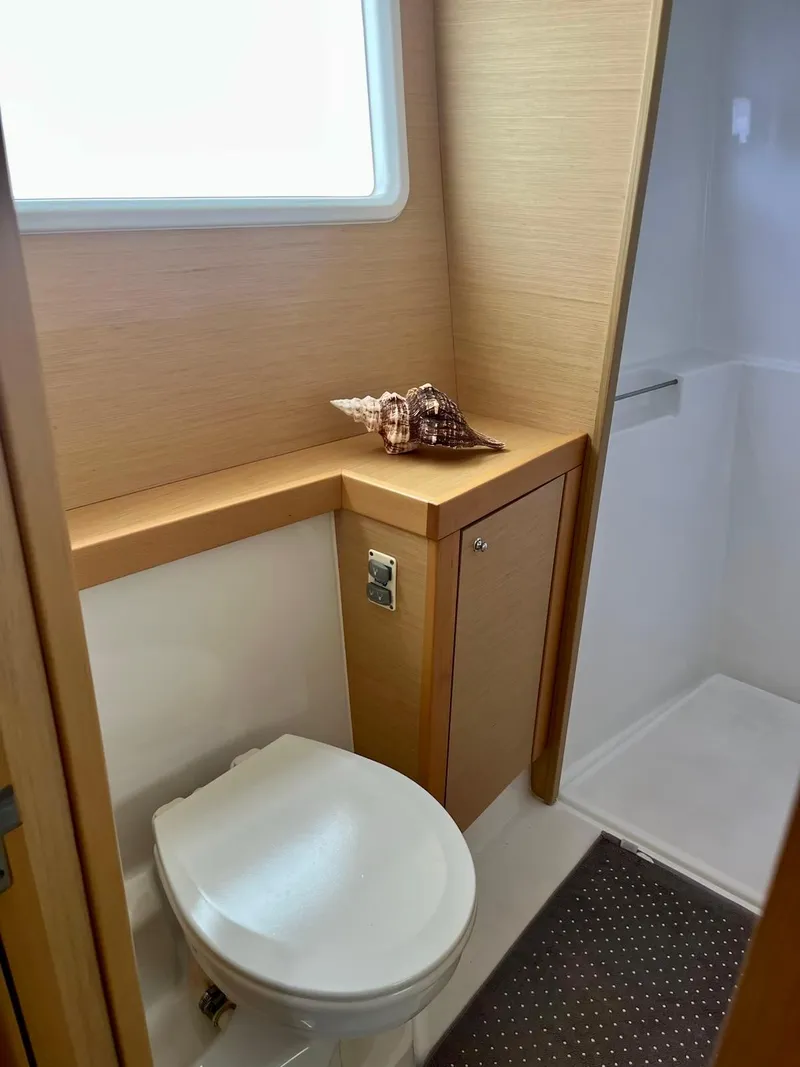 Slide: The Image of 2017 Lagoon 39 yacht bathroom with modern fixtures and decorative seashells. - 42
