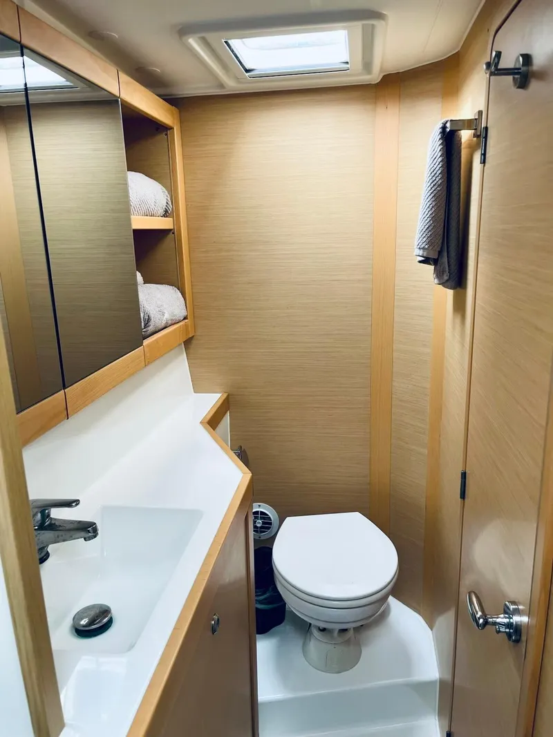 Slide: The Image of 2017 Lagoon 39 yacht bathroom with modern fixtures and wooden cabinetry. - 47