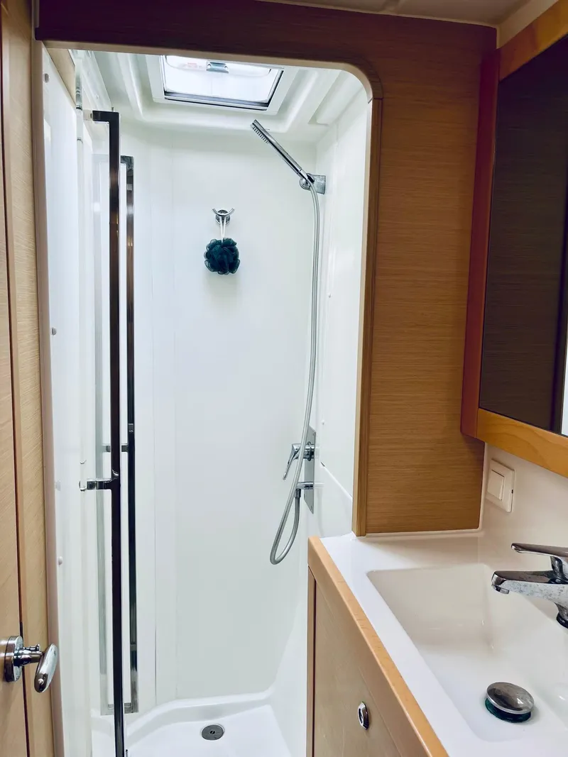 Slide: The Image of 2017 Lagoon 39 yacht bathroom with shower and sink. - 48