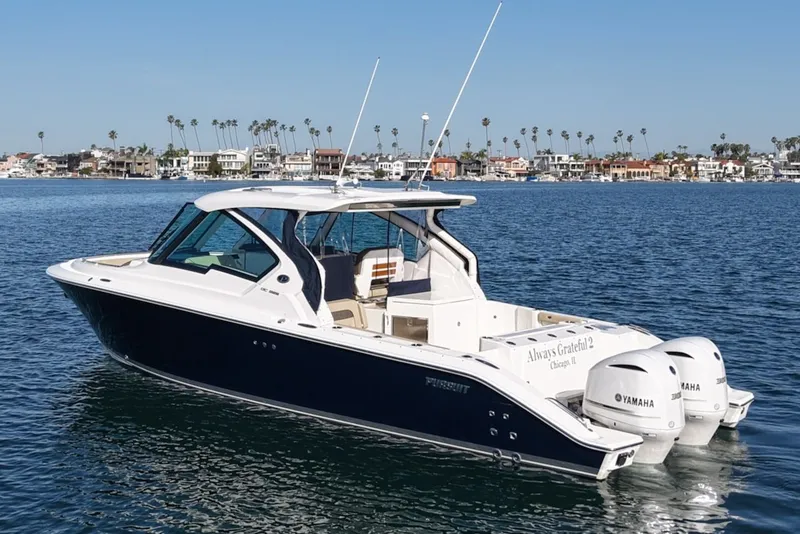 The Image of Pursuit DC 326 Dual Console 2021 on calm waters. - 0