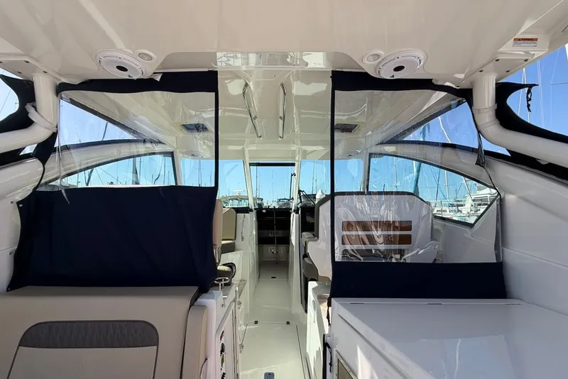 Slide: The Image of Interior of 2021 Pursuit DC 326 Dual Console with clear windows. - 25