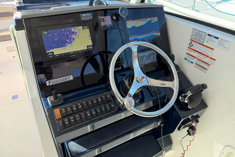 Slide: The Image of Pursuit DC 326 Dual Console 2021 helm with navigation system. - 29