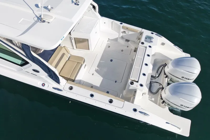 Slide: The Image of Aerial view of a 2021 Pursuit DC 326 Dual Console boat. - 3