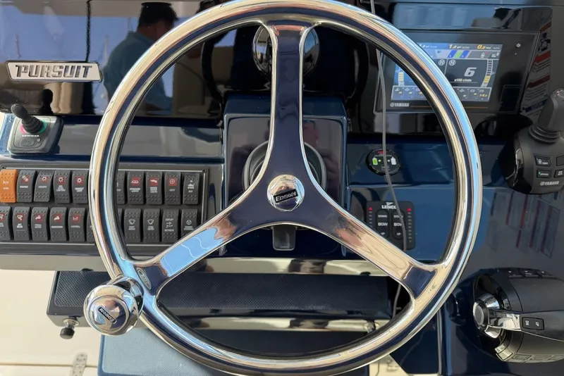 Slide: The Image of Steering console of the 2021 Pursuit DC 326 Dual Console. - 32