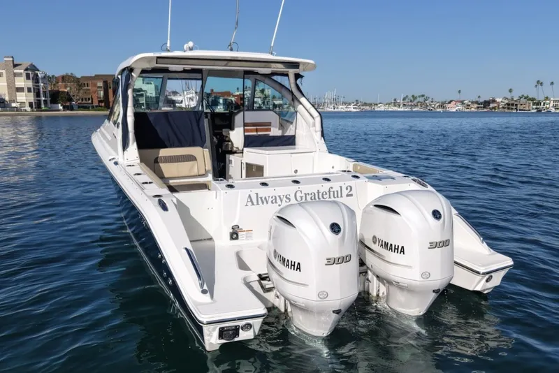 Slide: The Image of Pursuit DC 326 Dual Console 2021 on water with Yamaha engines. - 4