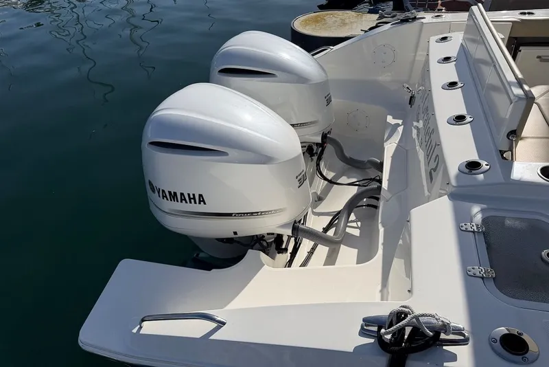 Slide: The Image of 2021 Pursuit DC 326 with Yamaha outboard motors on water. - 9