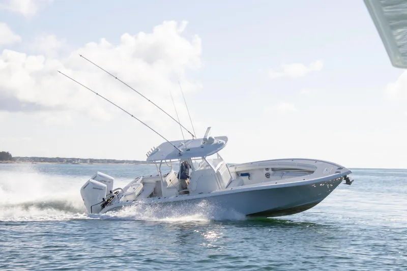 The Image of 2025 Yellowfin 32 Offshore boat cruising on open water, showcasing sleek design and performance. - 0