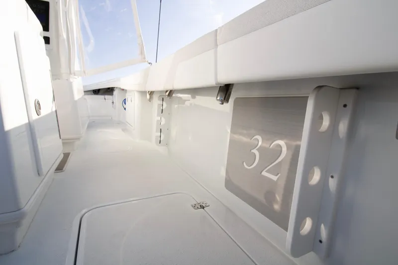 Slide: The Image of 2025 Yellowfin 32 Offshore boat interior, showcasing sleek white design and modern features. - 13