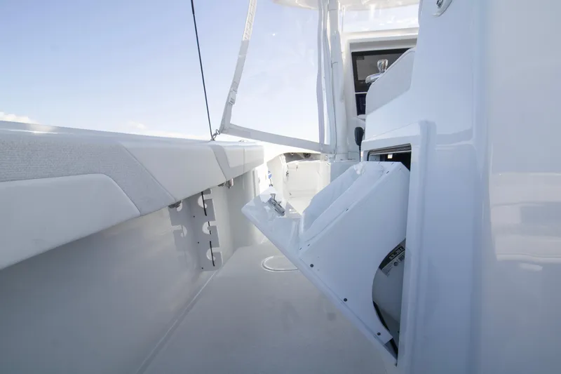 Slide: The Image of 2025 Yellowfin 32 Offshore boat interior with open storage compartment. - 17