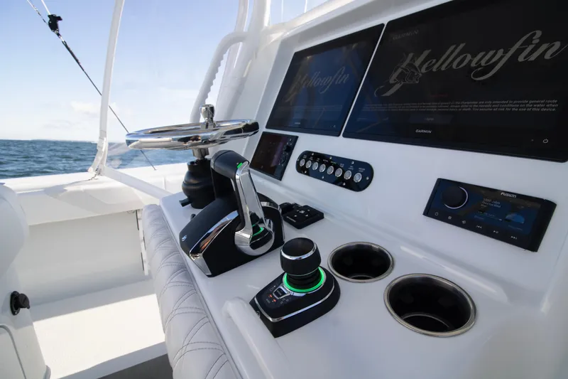 Slide: The Image of 2025 Yellowfin 32 Offshore boat cockpit with modern controls and navigation screens. - 20